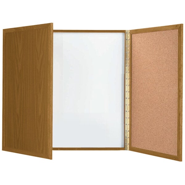 An Aarco oak laminate planning board with a cork and white board inside.