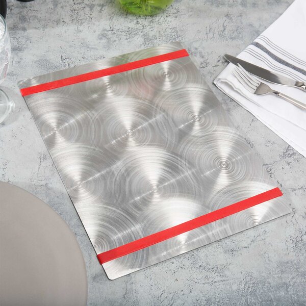 A Menu Solutions Alumitique menu board with red bands on a table with silverware and a napkin.