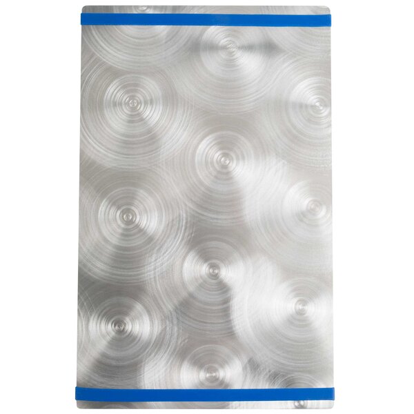 A silver rectangular Alumitique menu board with circles on it.