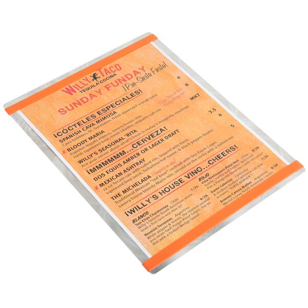 A Menu Solutions Alumitique menu board with orange bands on a table in a Mexican restaurant.