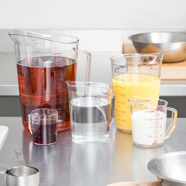 A Cambro measuring cup set on a kitchen counter.