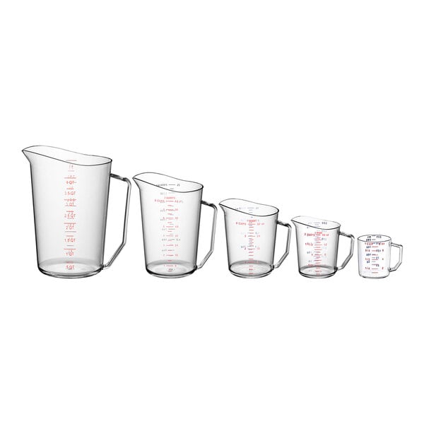 A group of Cambro Camwear polycarbonate measuring cups with red measurements on them.