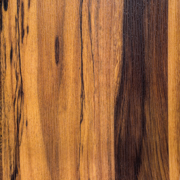 A close-up of a faux acacia wood grain on an American Metalcraft melamine serving peel.
