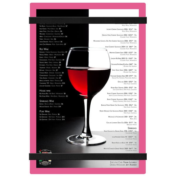 A pink Menu Solutions acrylic menu board with rubber band straps on a white background with a glass of wine.