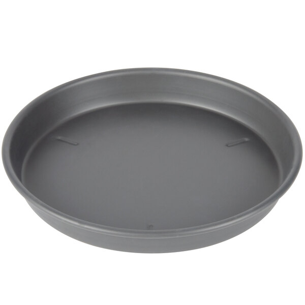 A round black Chicago Metallic deep dish pizza pan.