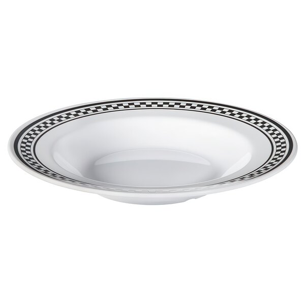 A white bowl with a black and white diamond patterned border.