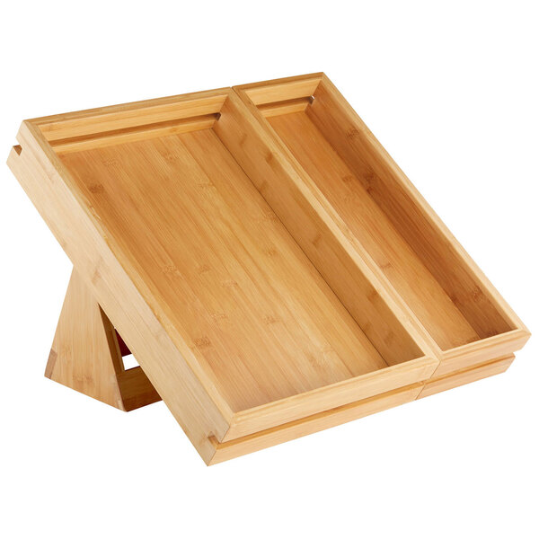 A wooden tray with a triangular base and two compartments on it.