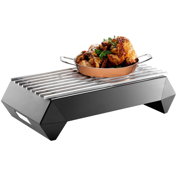 A black matte steel Rosseto Multi-Chef chafer alternative pan of food on a grill.