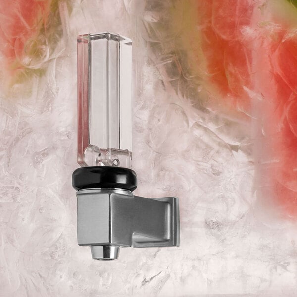 A white Rosseto acrylic beverage dispenser with a glass infusion chamber on a glass surface.