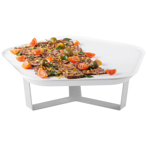 A white Rosseto Forme melamine tray with meat and vegetables on a stand.