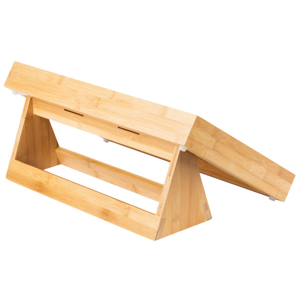 A natural bamboo rectangular tray riser on a wooden stand.