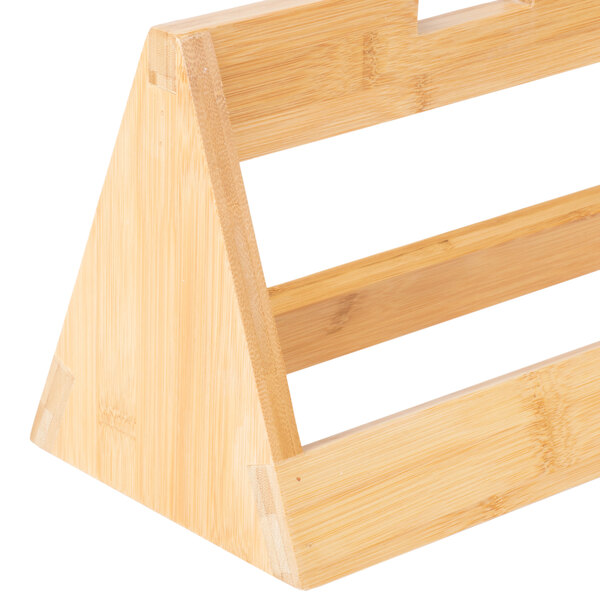 A Rosseto natural bamboo tray riser with three triangular shelves.