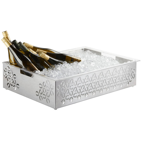 A Rosseto stainless steel ice housing with wine bottles on a table.