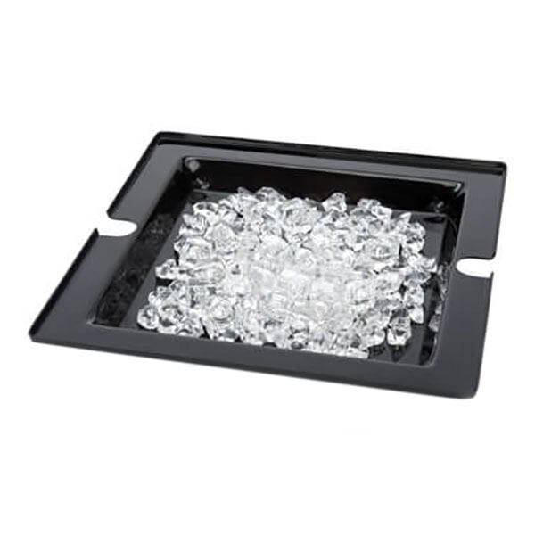 A black square tray with a pile of ice cubes.