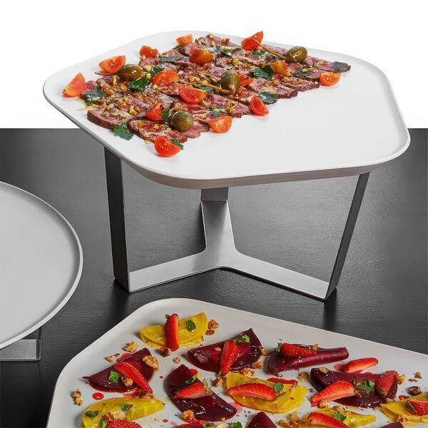 A white Rosseto polygon tray with fruit and vegetables on a table.