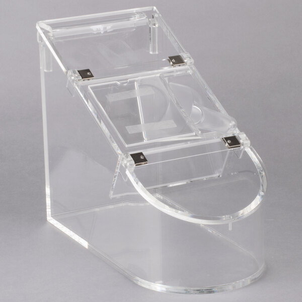 A clear plastic container with a curved handle.