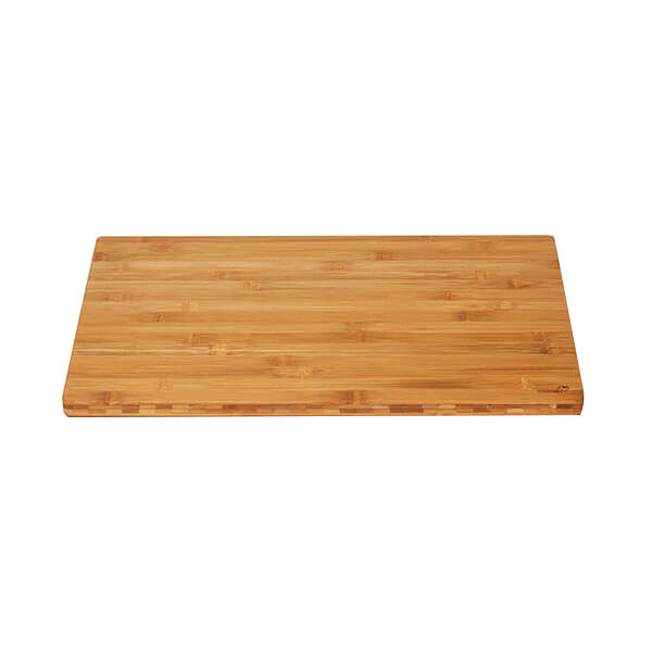 A Rosseto natural bamboo serving board on a table.