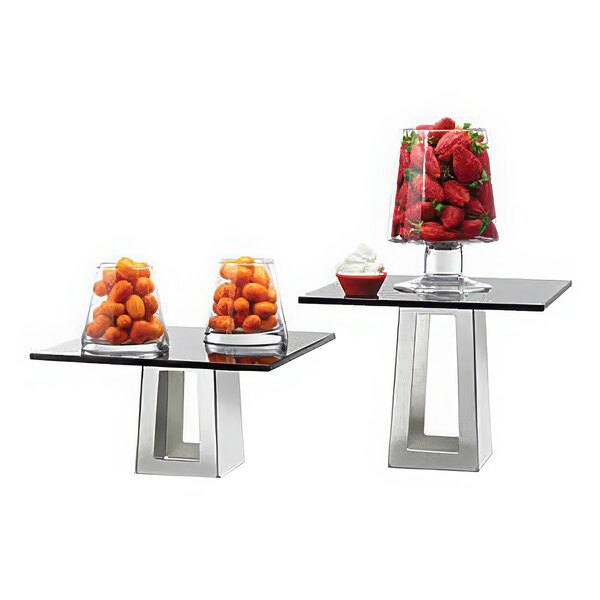 Two Rosseto stainless steel pyramid risers with fruit on them.