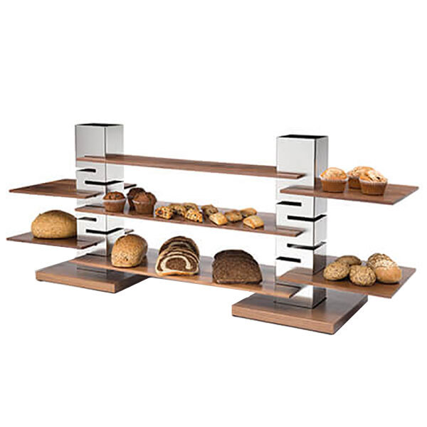 A Rosseto rectangular natural walnut wide riser shelf holding pastries and muffins.
