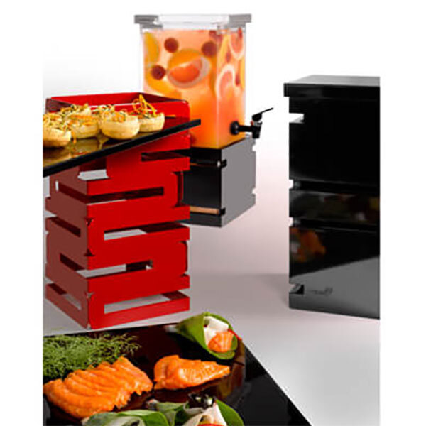 A red Rosseto multi-level riser with food and drinks on it.