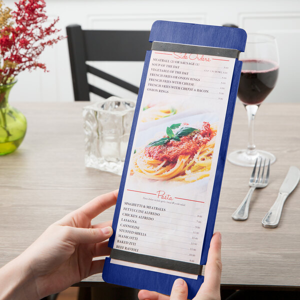 A person holding a customizable wood menu board with rubber band straps.