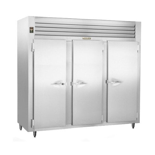 A large Traulsen reach-in freezer with three white doors.