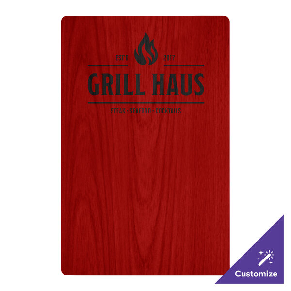 A red wood sign with black text that says "grillhaus"