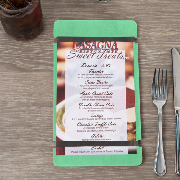 A Menu Solutions customizable wood menu board with rubber band straps on a table in an Italian restaurant.