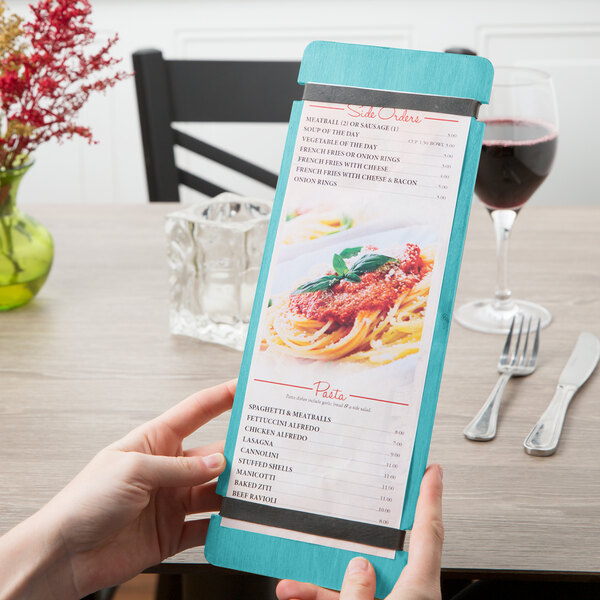 A person using a Sky Blue wood menu board with rubber band straps.