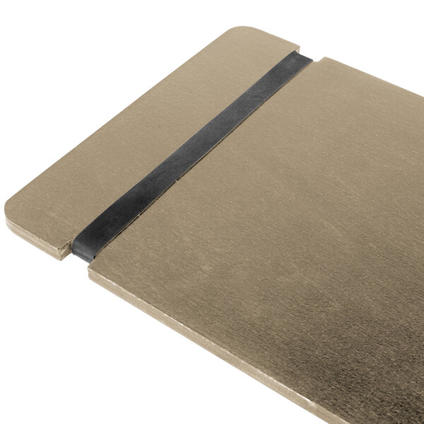 A Menu Solutions weathered walnut wood menu board with rubber band straps on a brown surface.