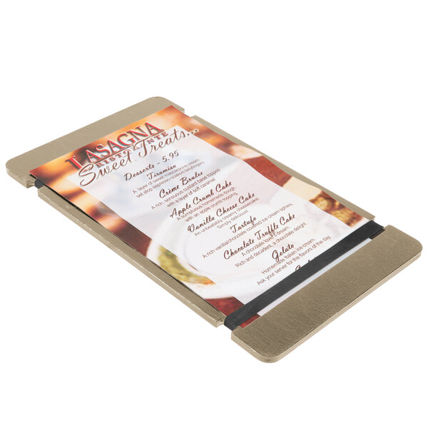 A Menu Solutions weathered walnut wood menu board with rubber band straps holding a menu card.