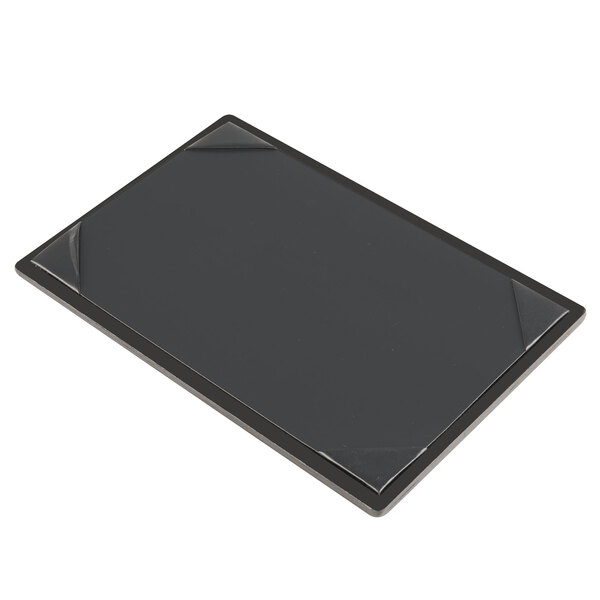 A black rectangular wood menu board with black corners.