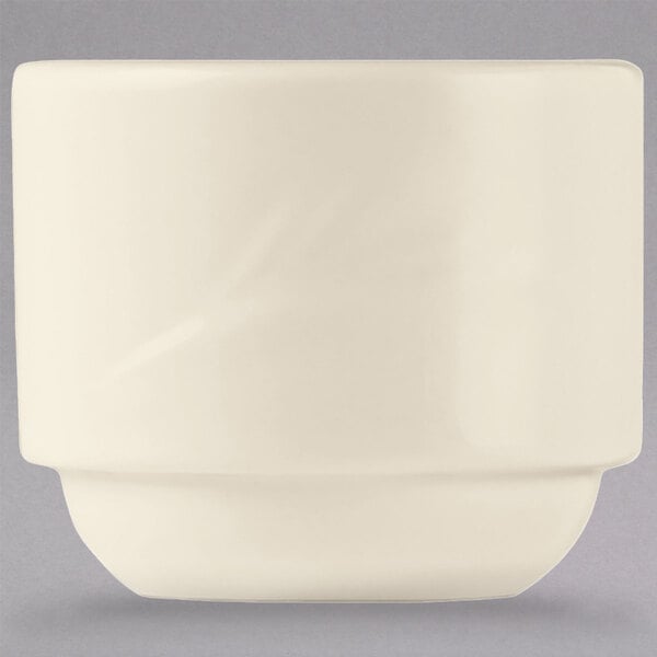 A white Libbey Endurance china bouillon cup with a curved edge.