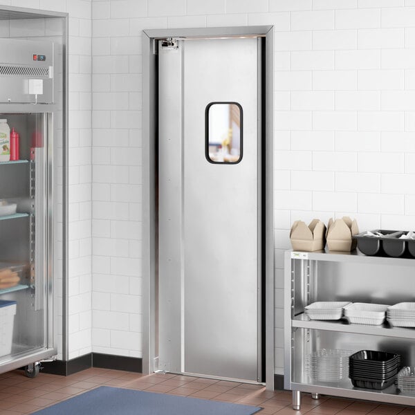 A white aluminum traffic door with a black rectangular window.