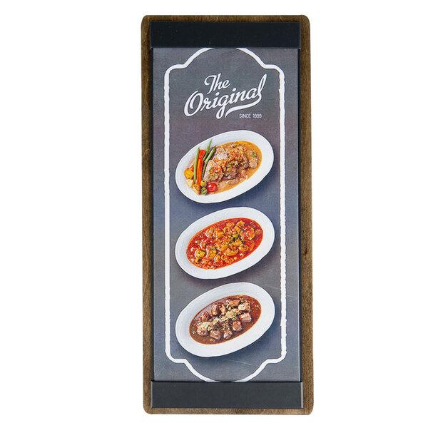 A Menu Solutions customizable wood menu board on a table with food displayed on it.