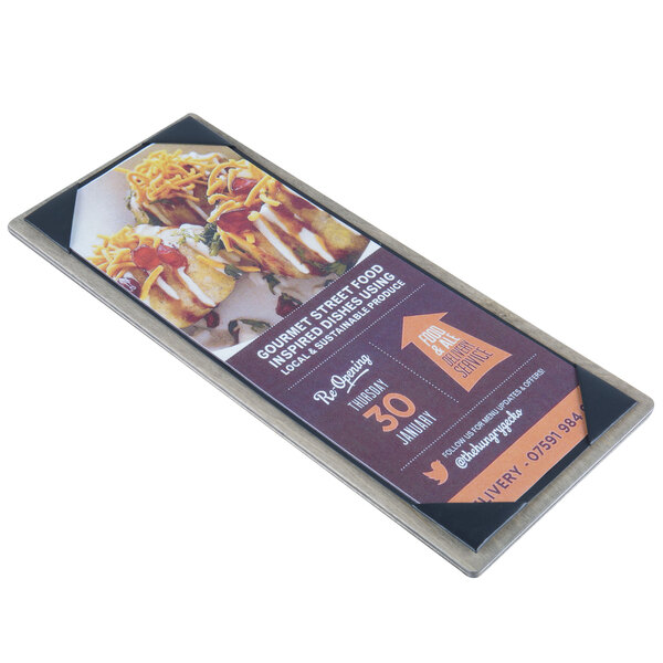 A rectangular natural wood menu board with top and bottom strips holding a black and white customizable sign with a picture of food on it.