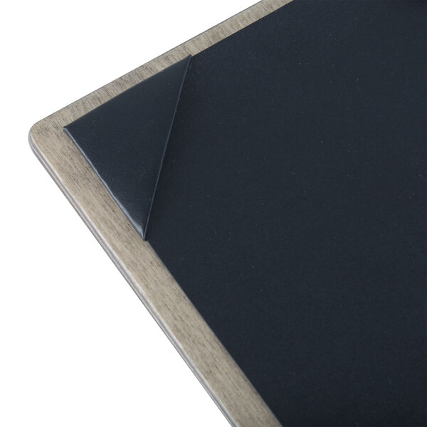 A close-up of a natural wood menu board with top and bottom strips.