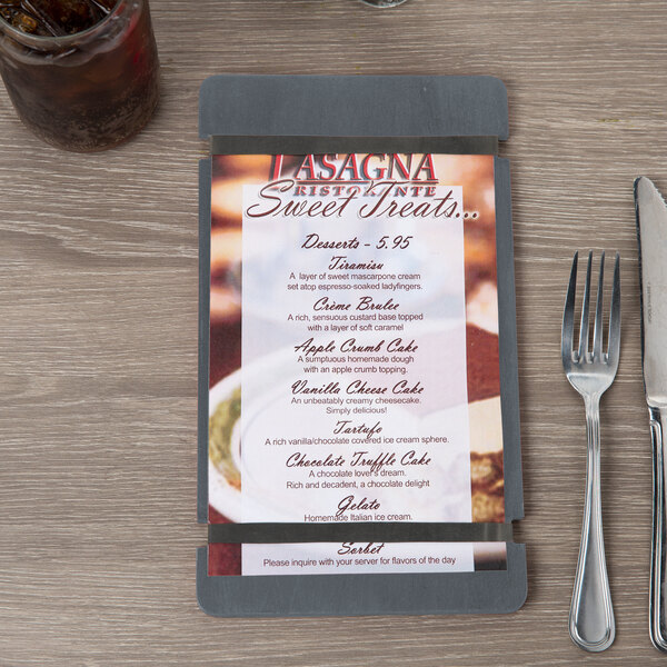 A Menu Solutions wood menu board on a table in an Italian restaurant.