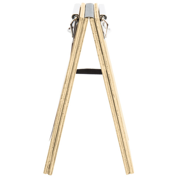 A natural wood menu board tent with a metal clip.