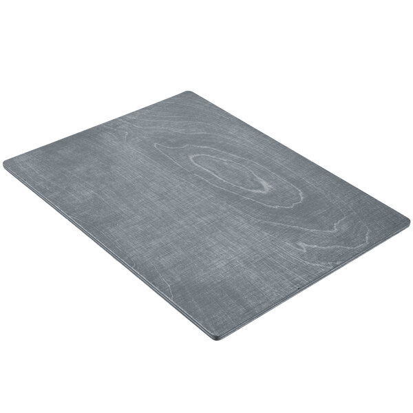 A grey rectangular wood menu board with a grainy surface.