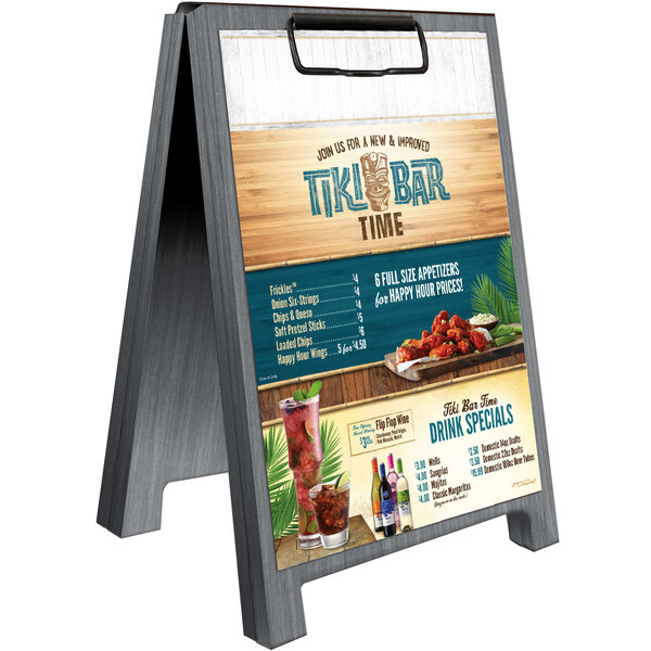 A Menu Solutions ash wood table tent with clip on a bar table.