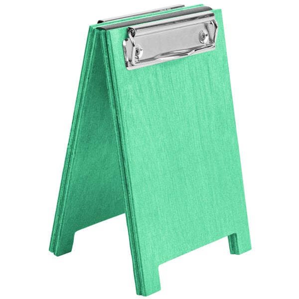 A green washed wood easel with a silver clip.
