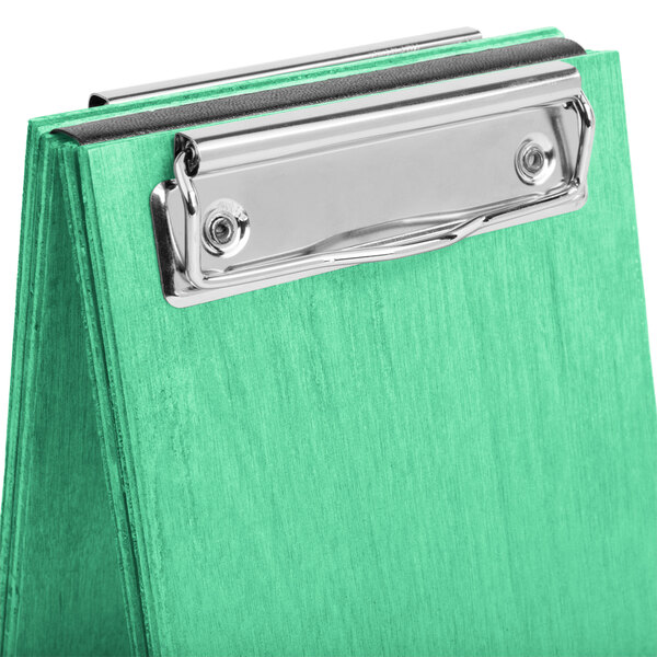 A washed teal wood clipboard with a silver metal clip.