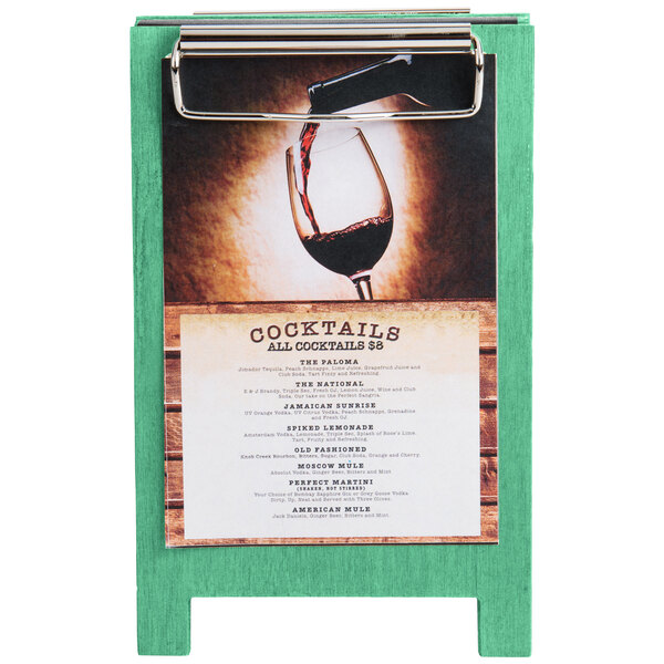 A Menu Solutions washed teal wood sandwich menu board tent with clip on a table.