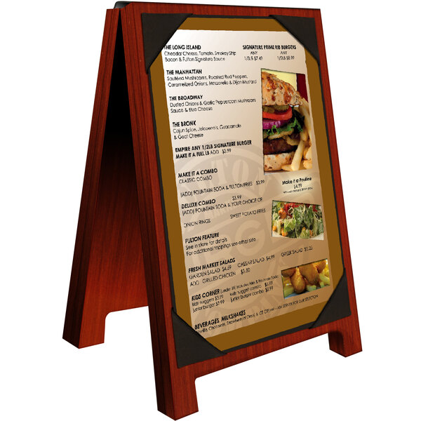 A mahogany wood Menu Solutions table tent with a picture of food on it.