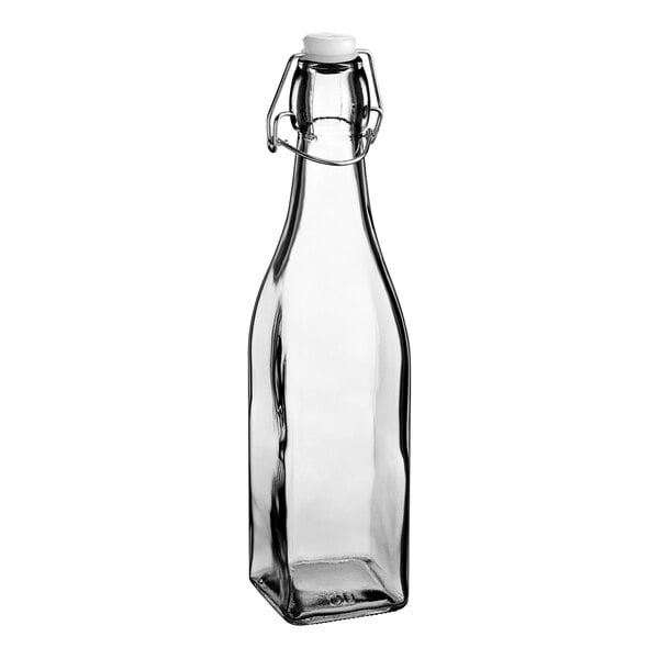 A close-up of an Acopa clear glass bottle with a wire bail swing top lid.