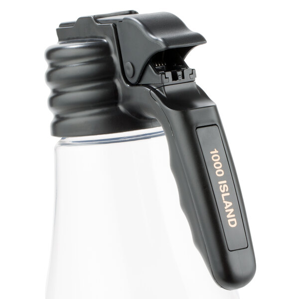 A black polypropylene tag with orange text on a clear bottle with a black clip.