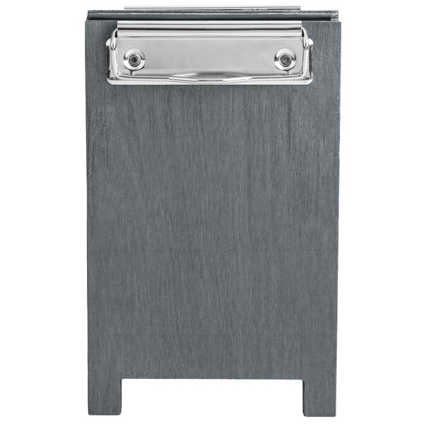 A Menu Solutions ash wood table tent with a white clip.