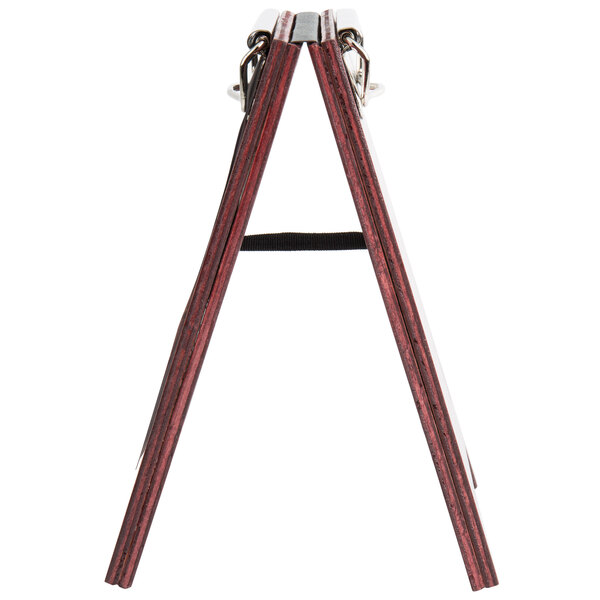 A mahogany wood menu board tent with a metal clip.