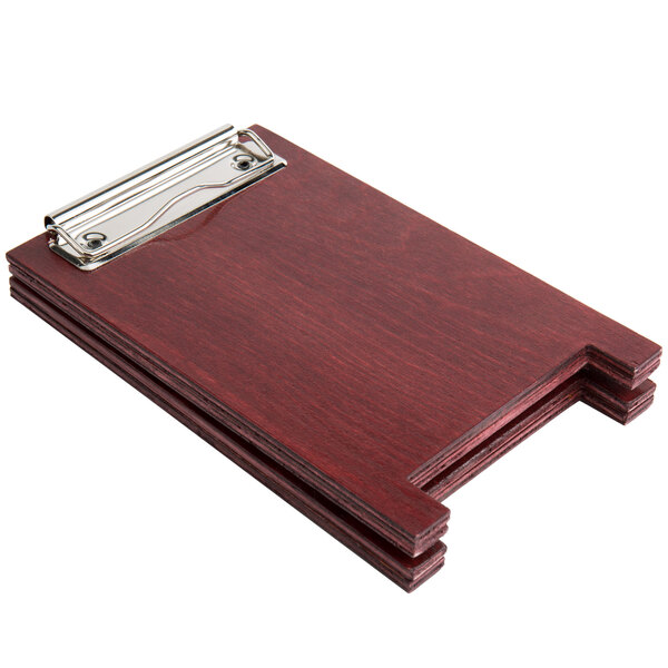 A Menu Solutions mahogany wood menu board tent with a metal clip.